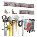 Wall-mounted tool organizer with three metal panels and red hook rails holding tools