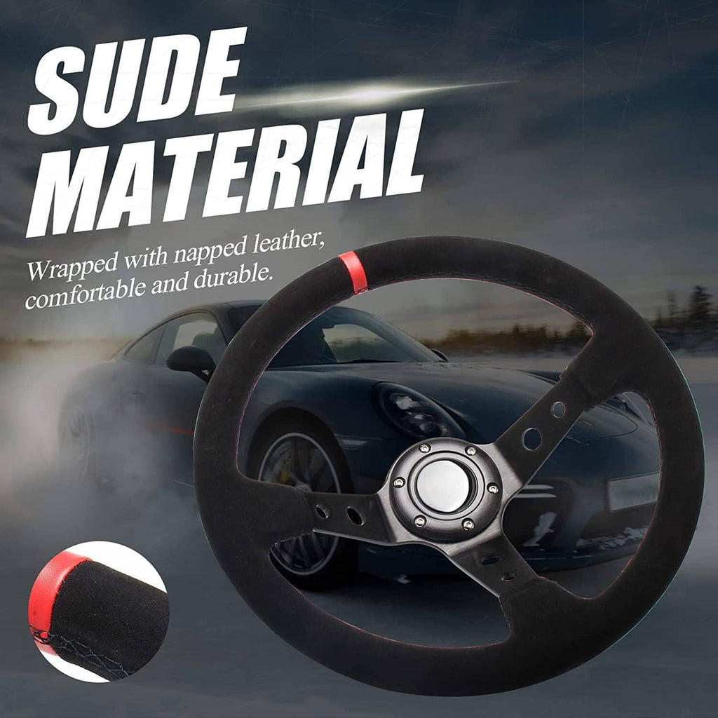 Black suede steering wheel with red accent and metal horn button center