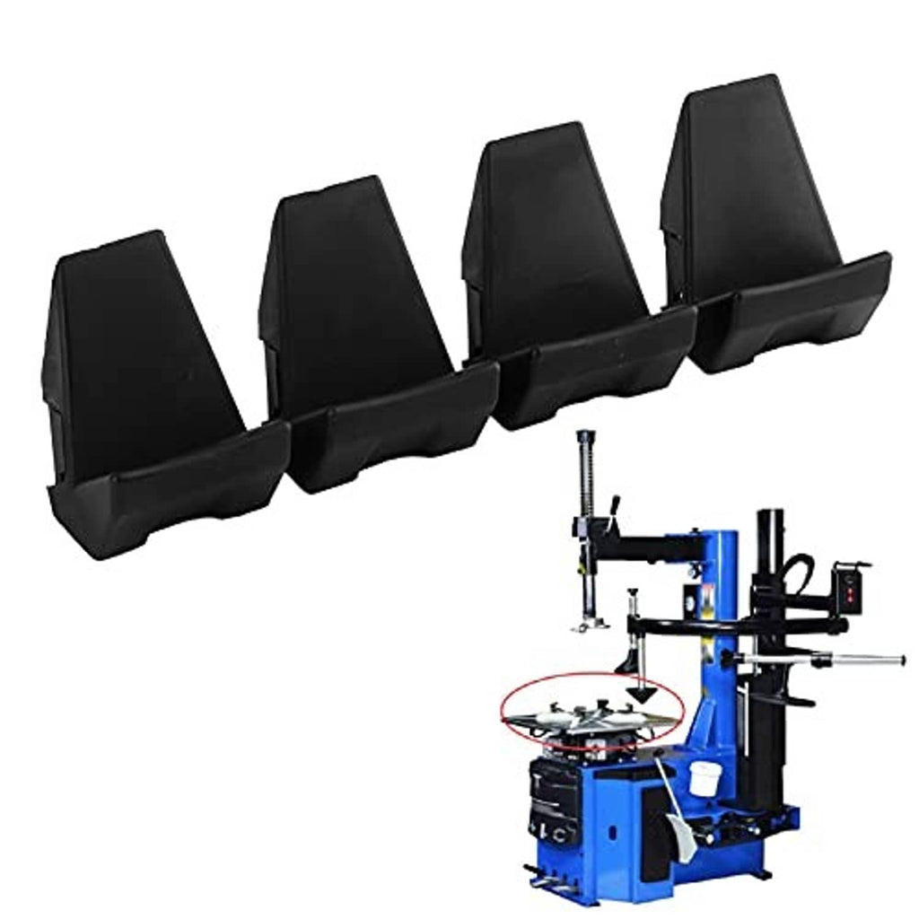 Four black rim jaw covers mounted in a row, protective clamp pads for tire changer