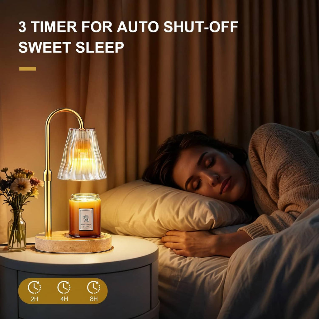 Luxmore candle warmer lamp with amber metal stand, fluted glass shade, and lit candle jar on base