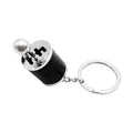 Car gear shifter keychain with black barrel, silver top, and round keyring