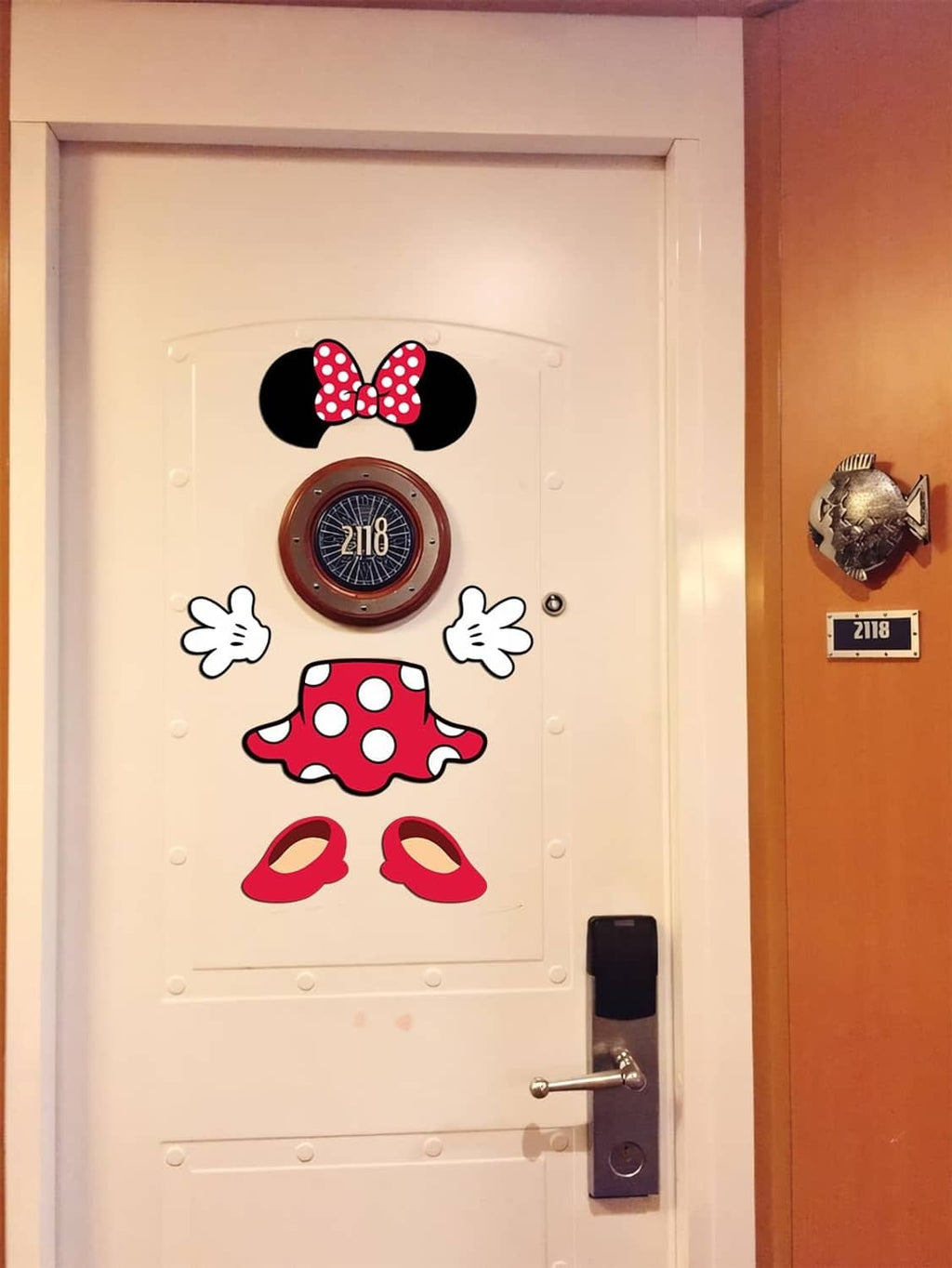 Captain mouse door magnets on white door: mouse ears, red polka dot hat, red shoes