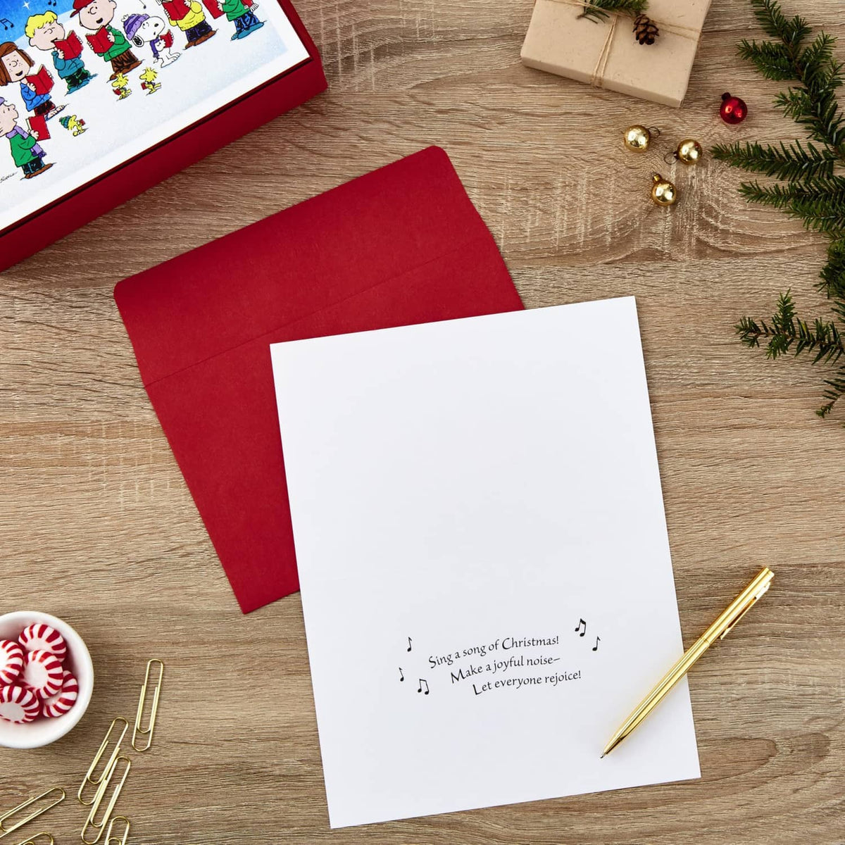 Folded holiday card with red envelope; small verse printed at bottom on white inside panel