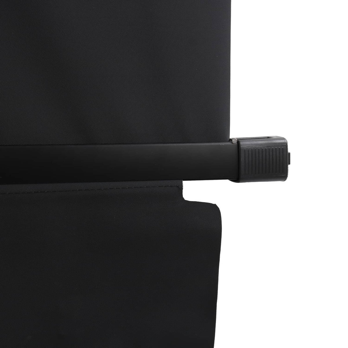 Black cargo cover end with ribbed slider-style clip at lower edge.
