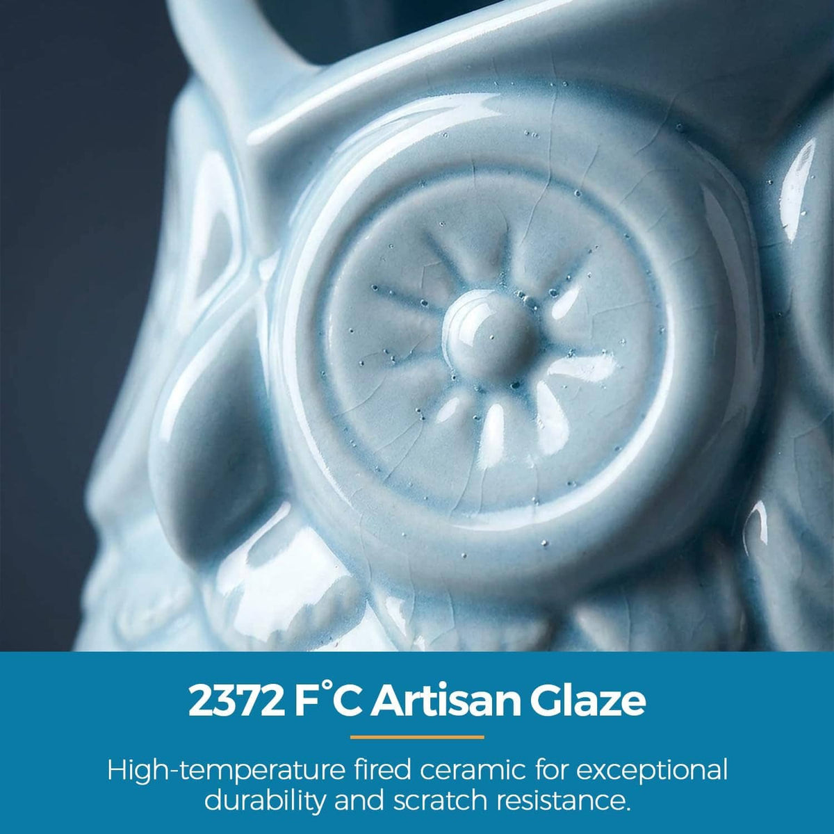 Light blue glazed ceramic owl pen holder close-up of embossed eye detail