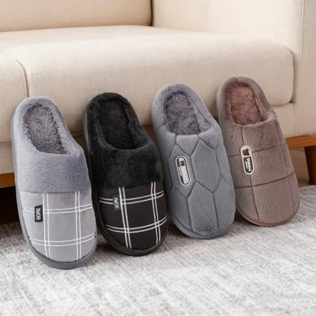 Plush house slippers in grey, black, and tan tones with wide plaid strap and cushioned sole
