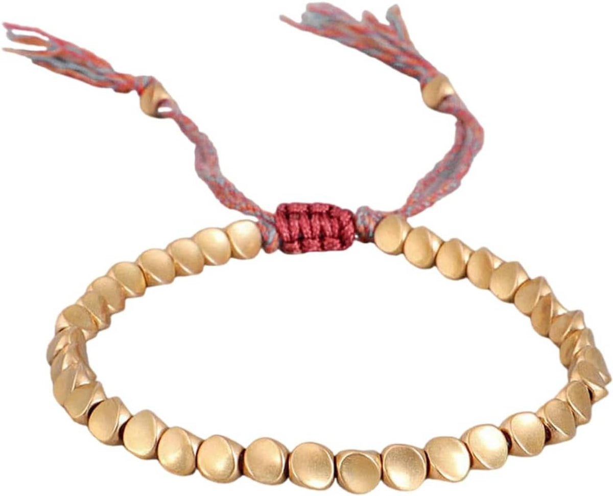 Gold-tone bead bracelet with red braided knot and multicolor cord tassels.