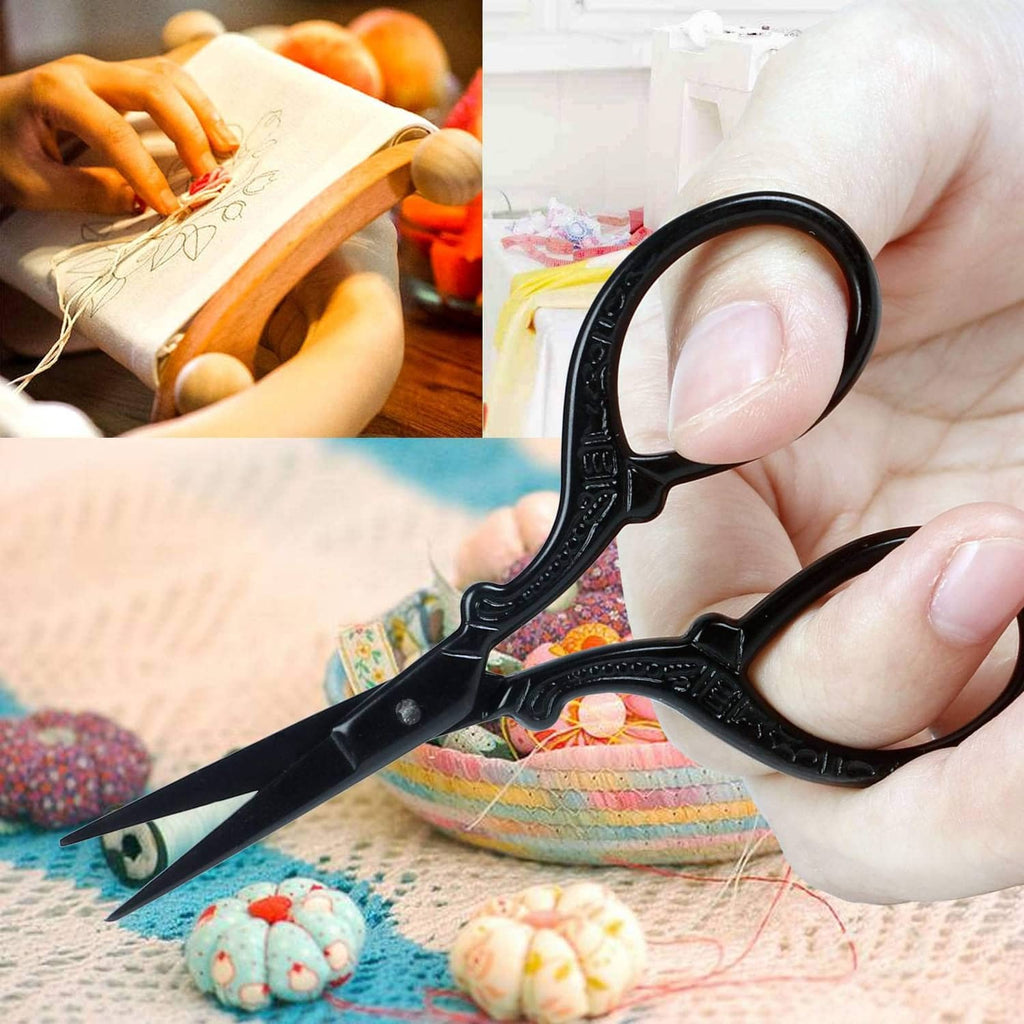 Black sharp-tip scissors trimming fabric during embroidery stitching