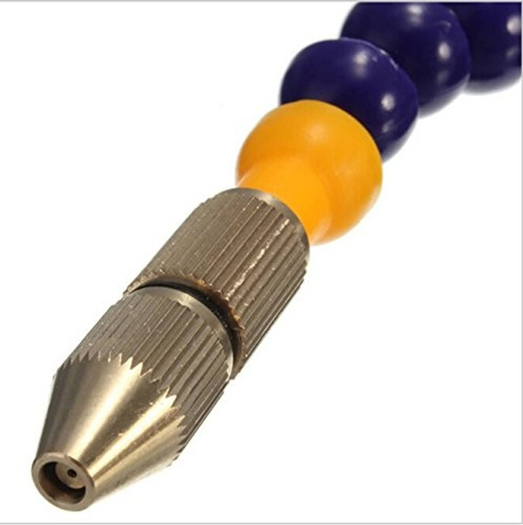Close-up of mist coolant spray nozzle tip with ribbed brass connector and yellow joint