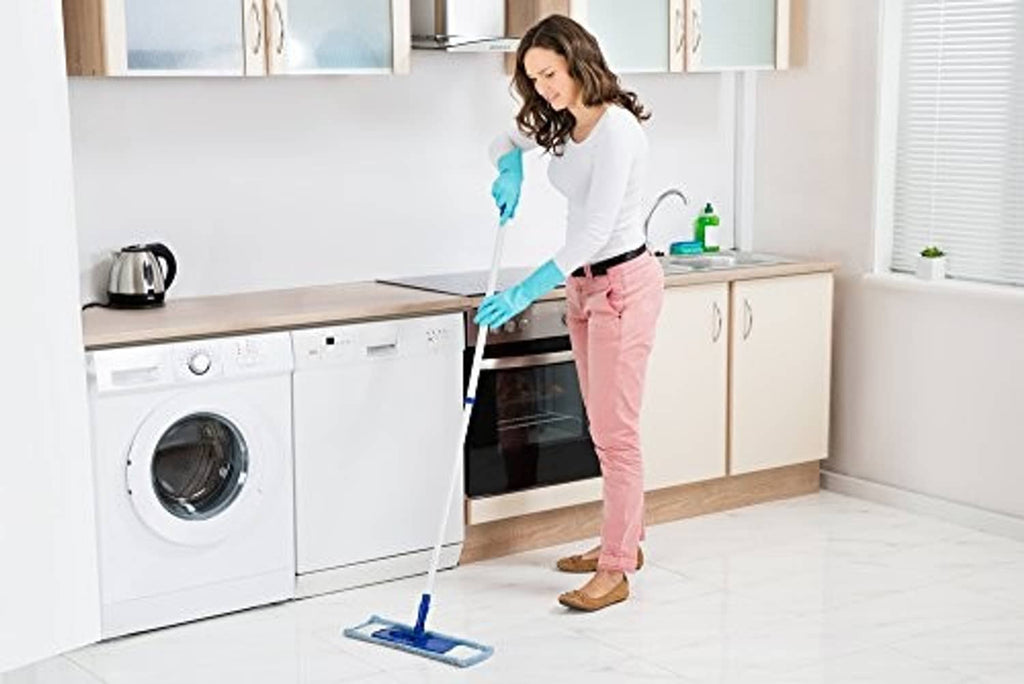 Teal nitrile rubber cleaning gloves worn while cleaning a kitchen floor