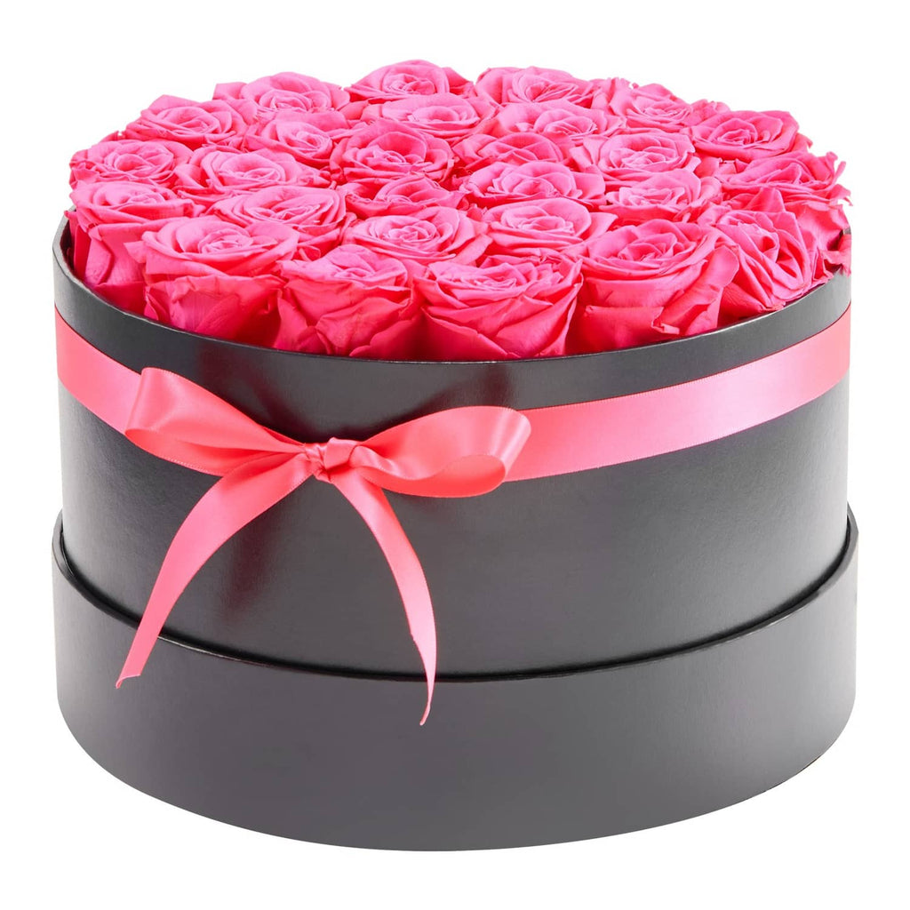 Round preserved rose bouquet in black box with pink ribbon, bright pink roses on top