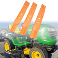 Orange lawn mower deck blades with mounting holes, shown installed on a mower