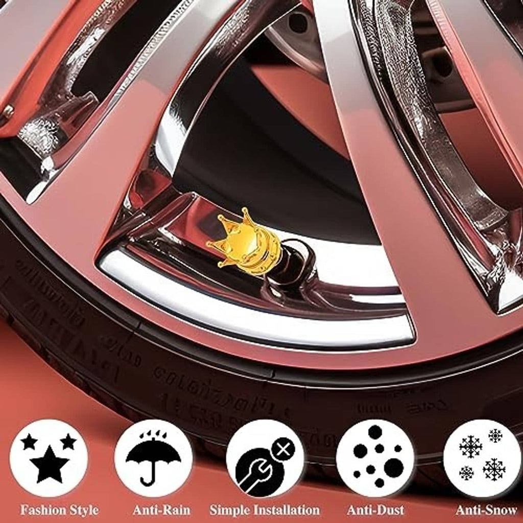 Close-up of a gold crown tire valve stem cap on a car wheel rim
