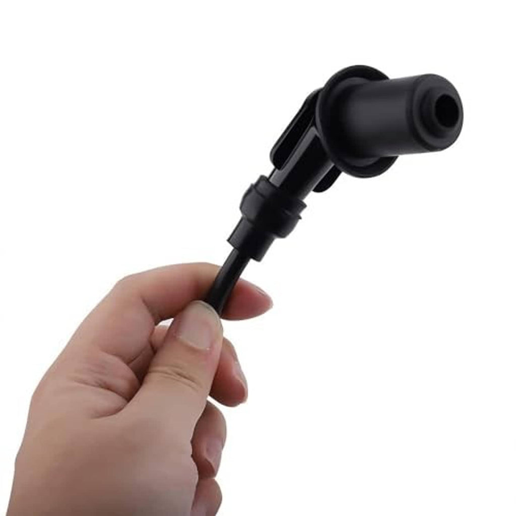 Ignition coil connector with black rubber lead, held by hand