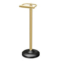 Freestanding toilet paper holder in polished brass with matte black round base