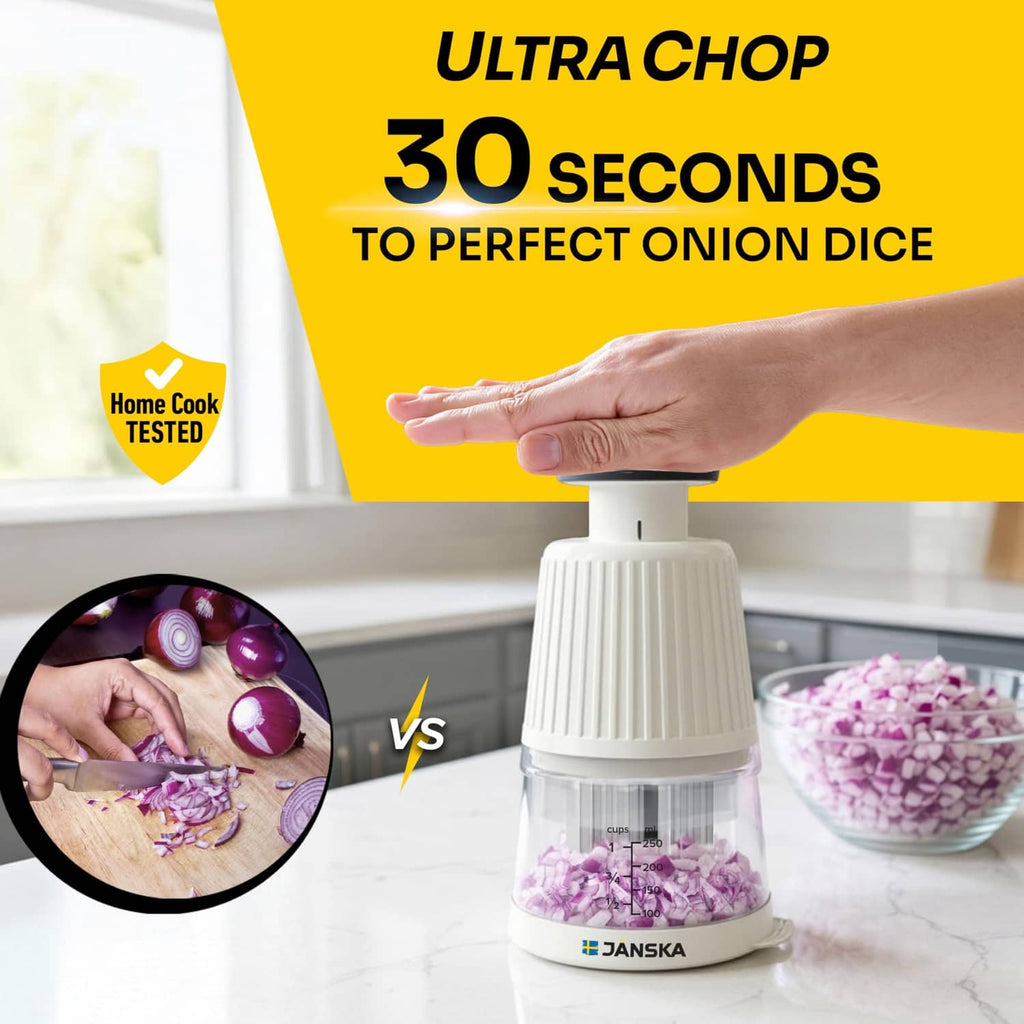 White push chopper on counter with hand pressing the top, clear bowl visible
