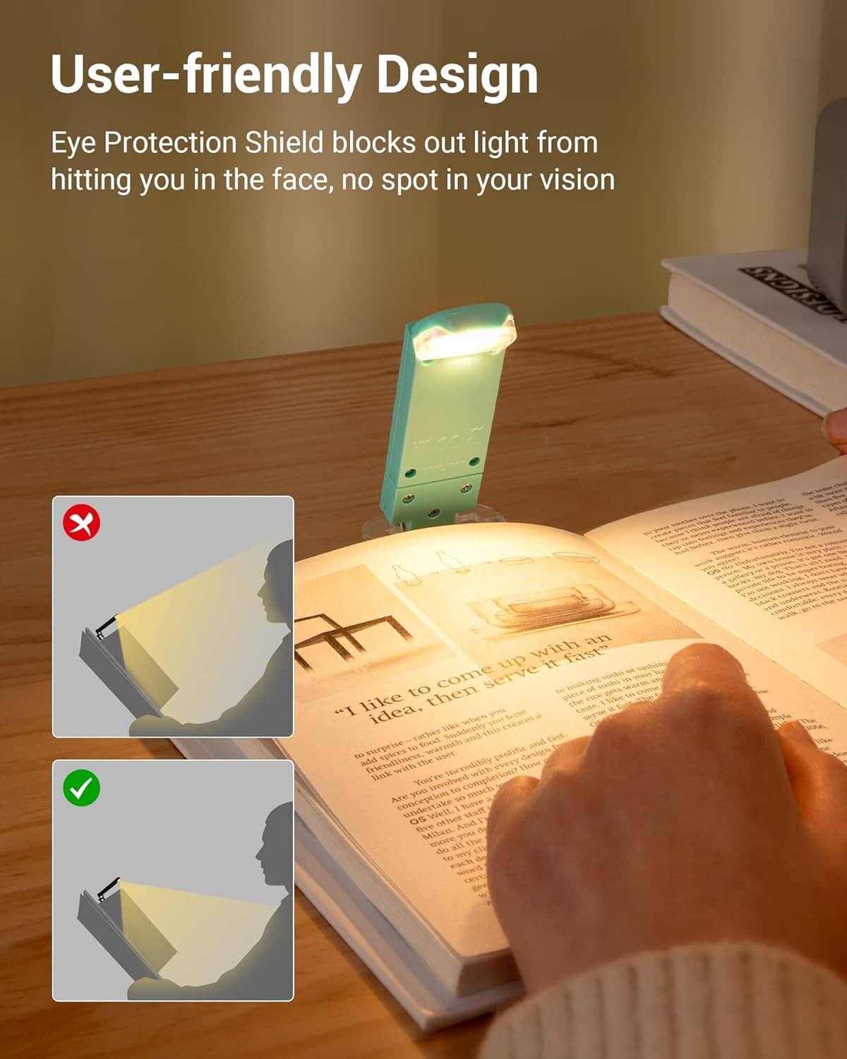 Turquoise clip-on LED book light with shield, aimed to illuminate book page.