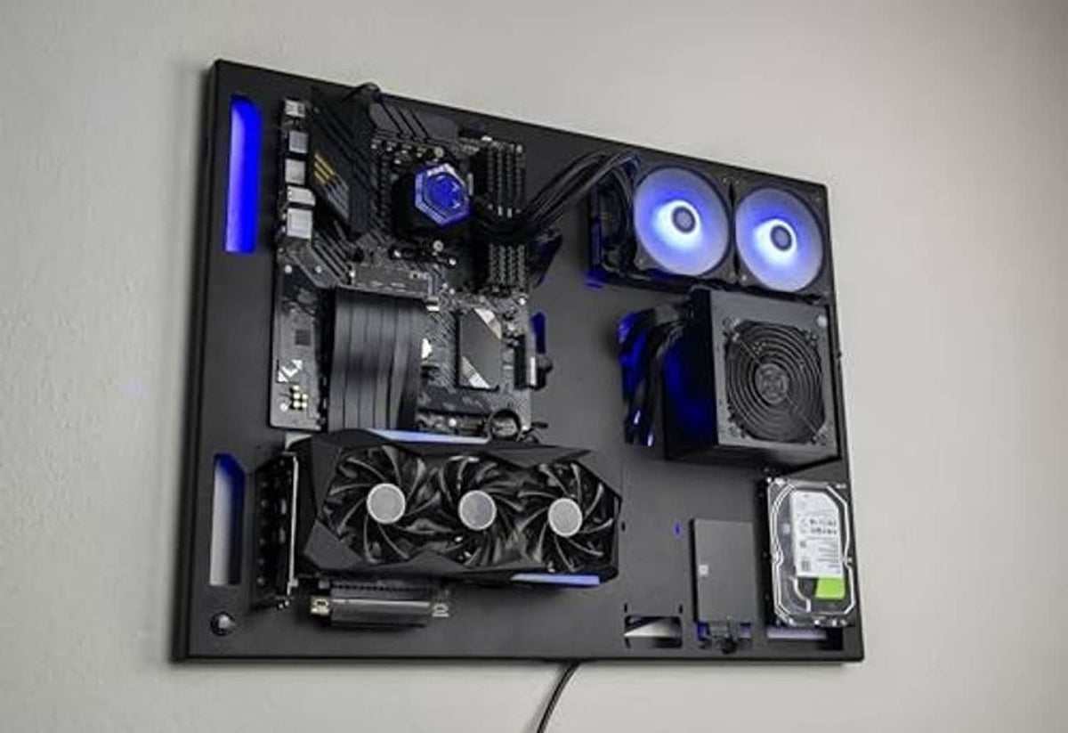 Wall-mounted gaming PC case, black interior with blue-lit CPU cooler, fans, and HDD