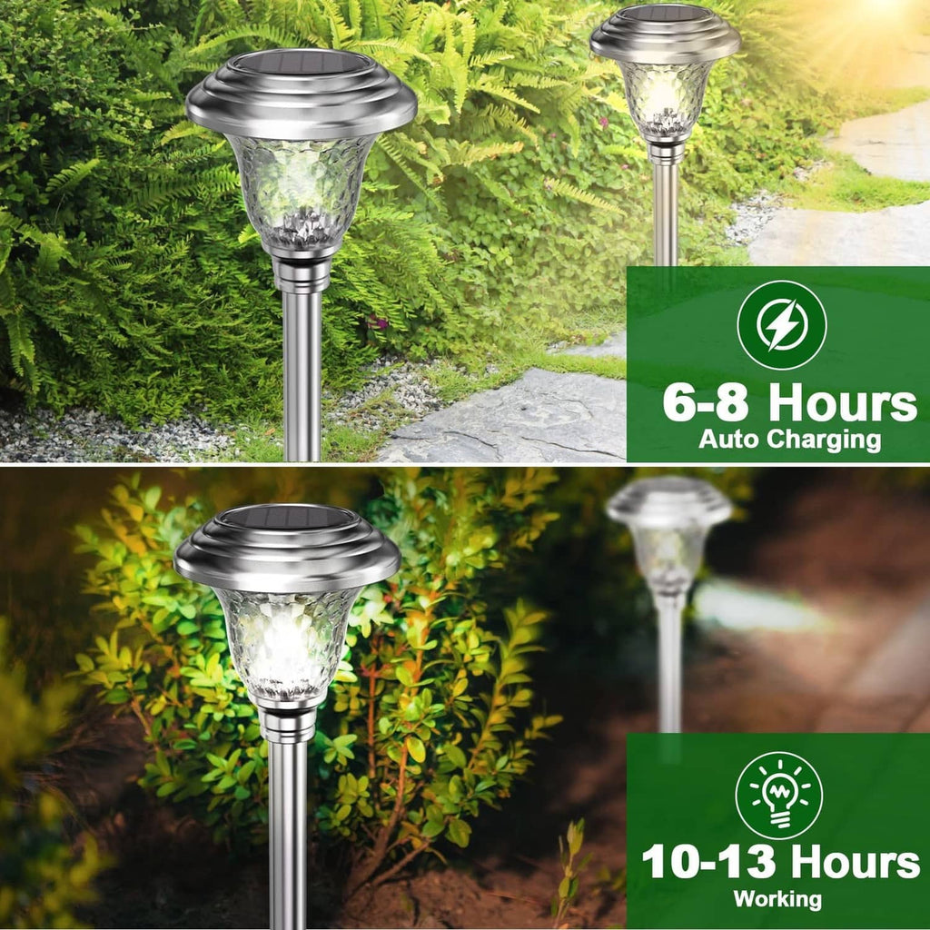 Solar pathway light with stainless-steel stem and frosted glass shade, glowing outdoors.