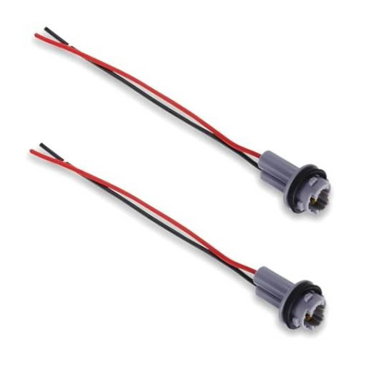 Two car light bulb pigtail sockets with gray housings and red/black wire leads