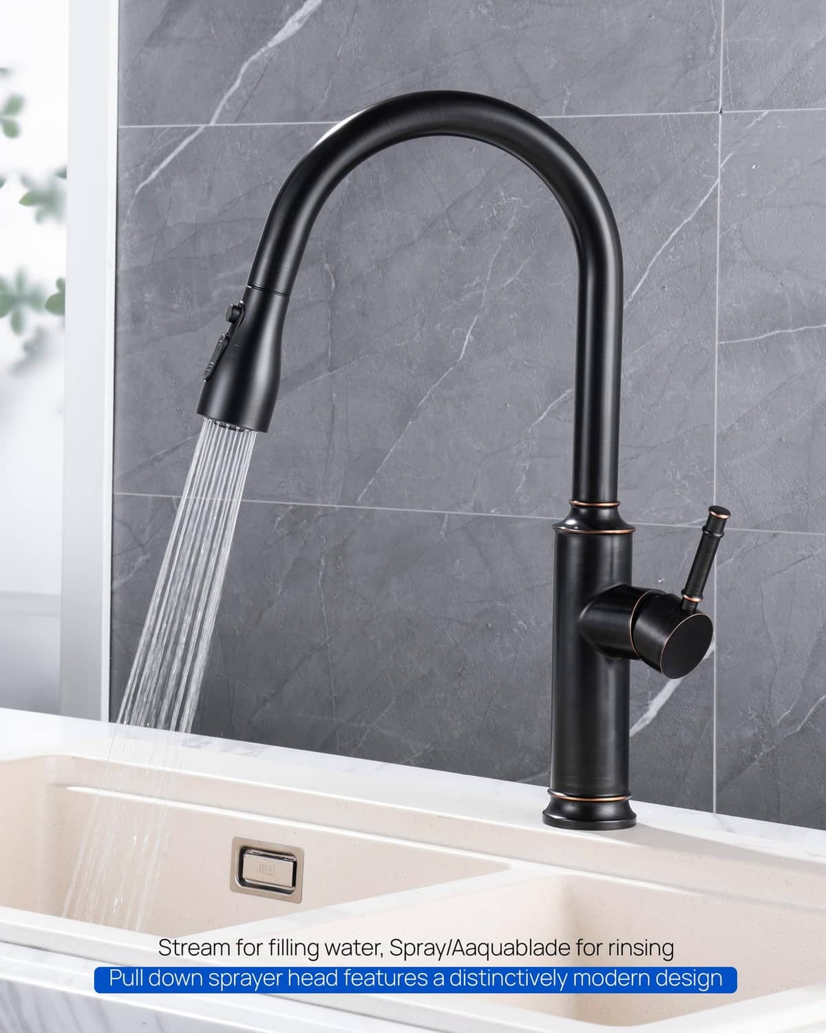 Oil-rubbed bronze pull-down faucet sprayer head attached to kitchen faucet