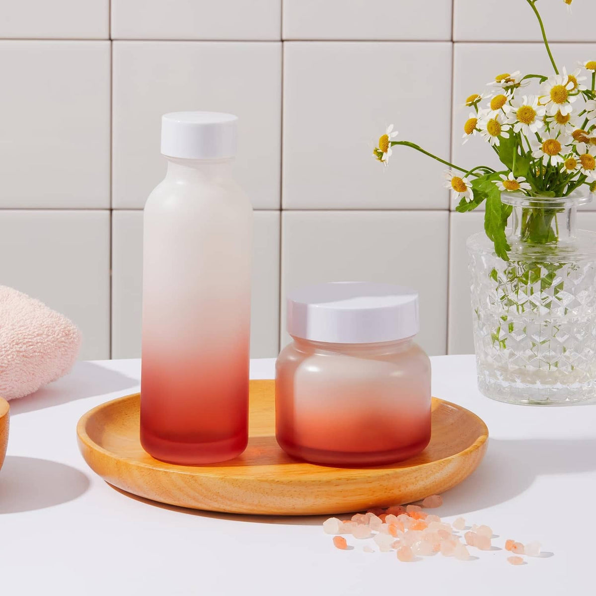 Aluminum bottle cap liners with amber bottles and white caps on round tray