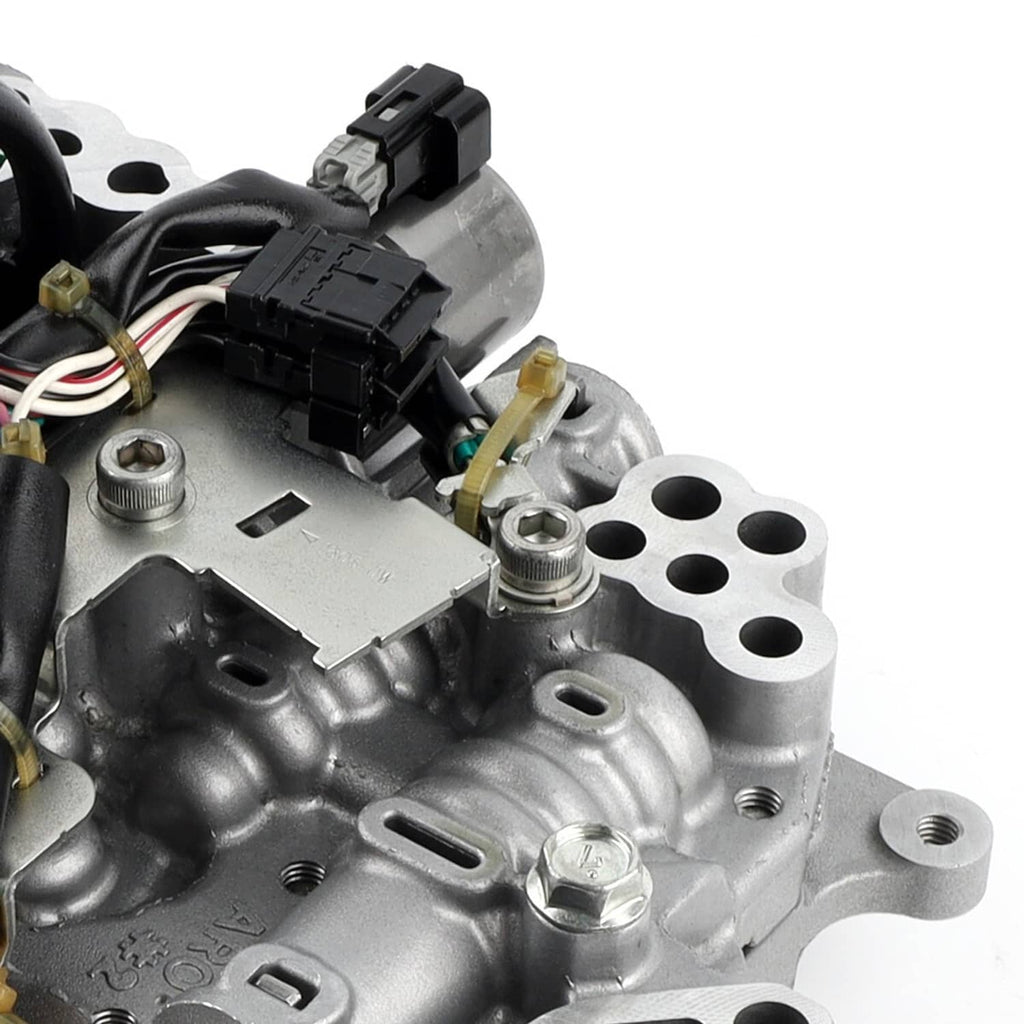 CVT transmission valve body with solenoids, close-up of relay blocks and wiring connectors