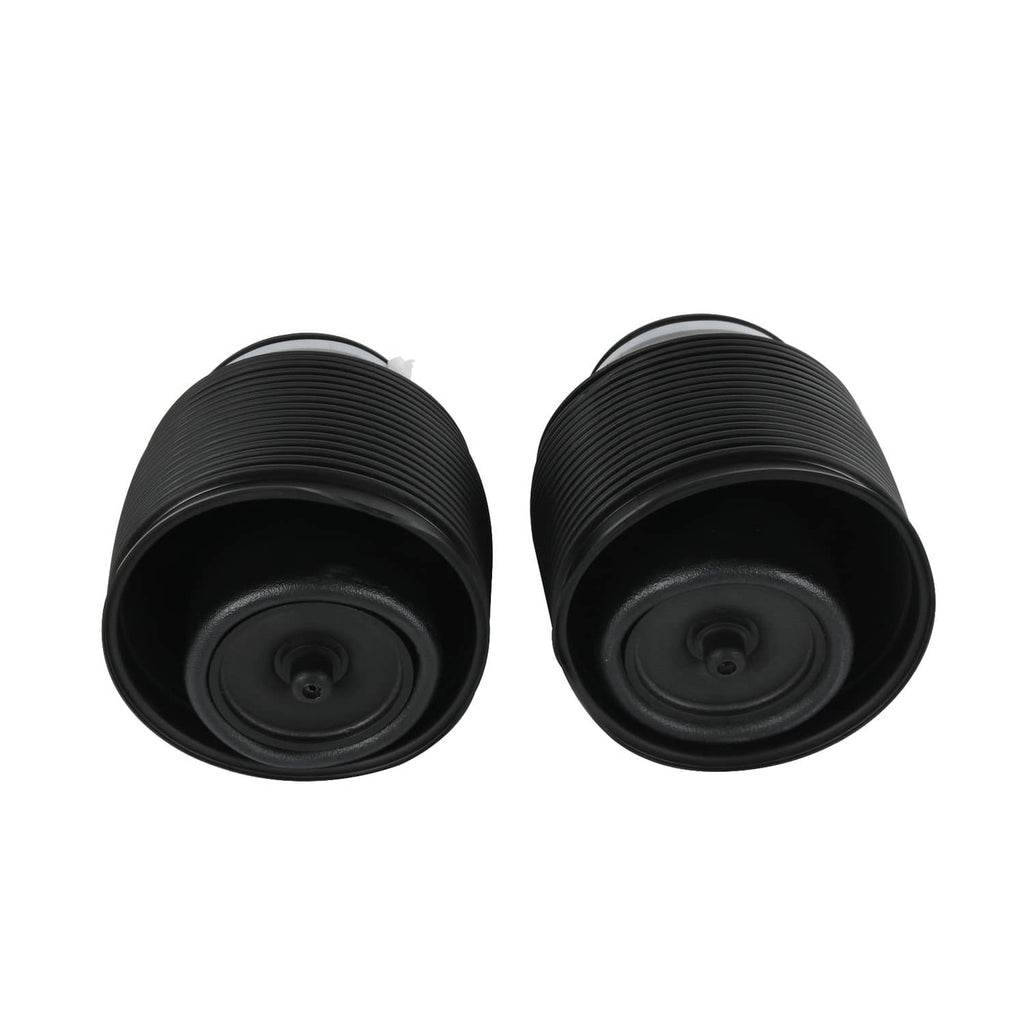 Two black air suspension spring bags, front views showing circular air ports.