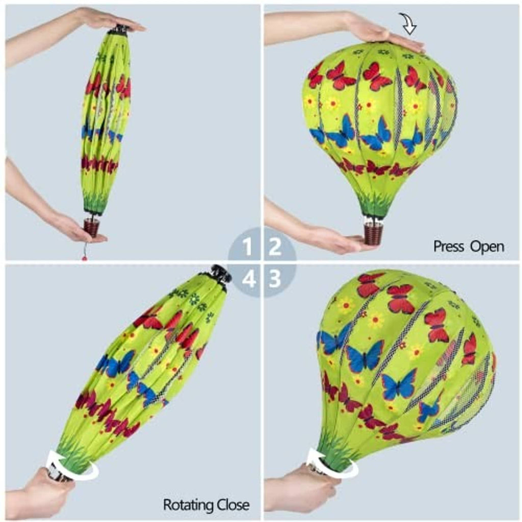 Green hot air balloon wind spinner with rotating close/open mechanism for tail