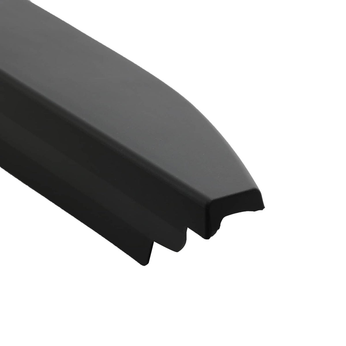 Black tailgate bed cap molding end piece close-up with curved notch