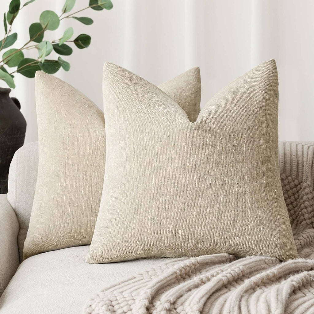 Cement textured chenille throw pillow, beige square cushion with stitched seam lines.