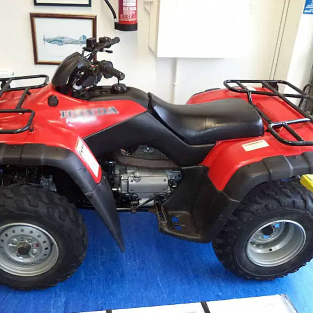 Black ATV rider seat with contoured, single-piece padded cushion for Rancher