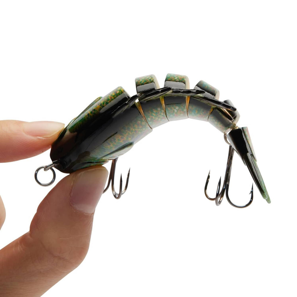 Hand-held multi-jointed fish lure in green and orange with front and tail treble hooks