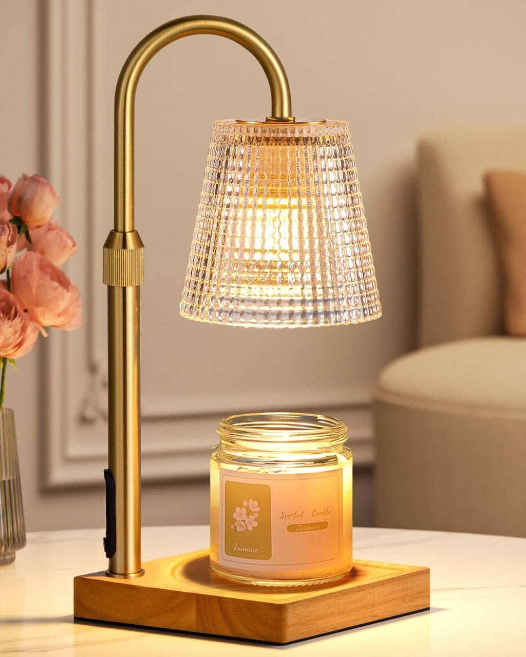 Brass candle warmer lamp with clear textured shade and glass jar on wooden base