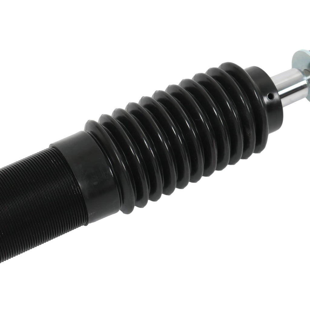 Close-up of black coilover strut spring and silver piston rod end
