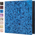 Blue floral photo album with leather-look cover and visible black spine.
