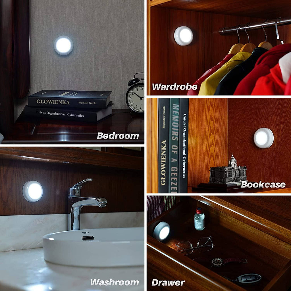 White LED motion sensor puck lights illuminated for placement on surfaces
