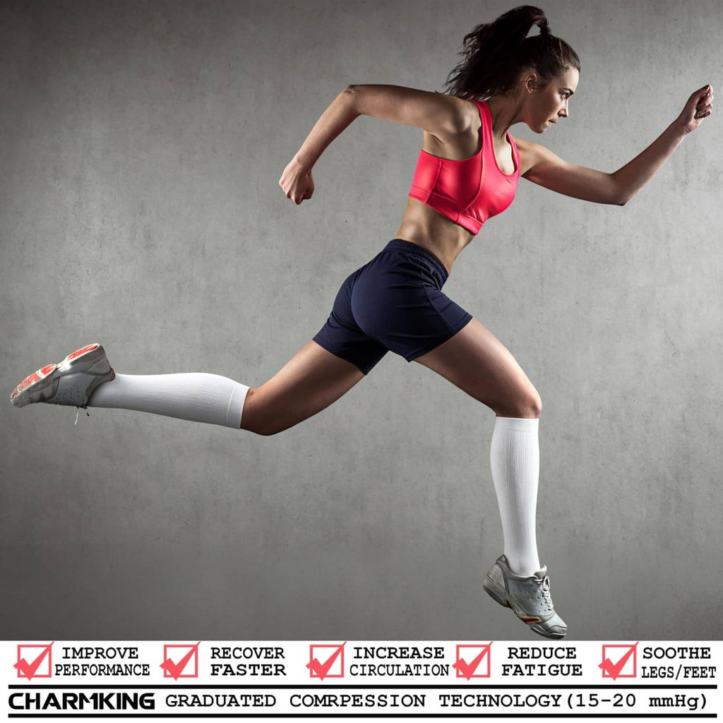 White compression socks on a runner’s legs for circulation support