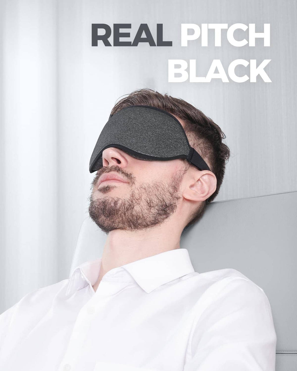 Dark gray sleep mask with black edge, contoured eye openings with strap