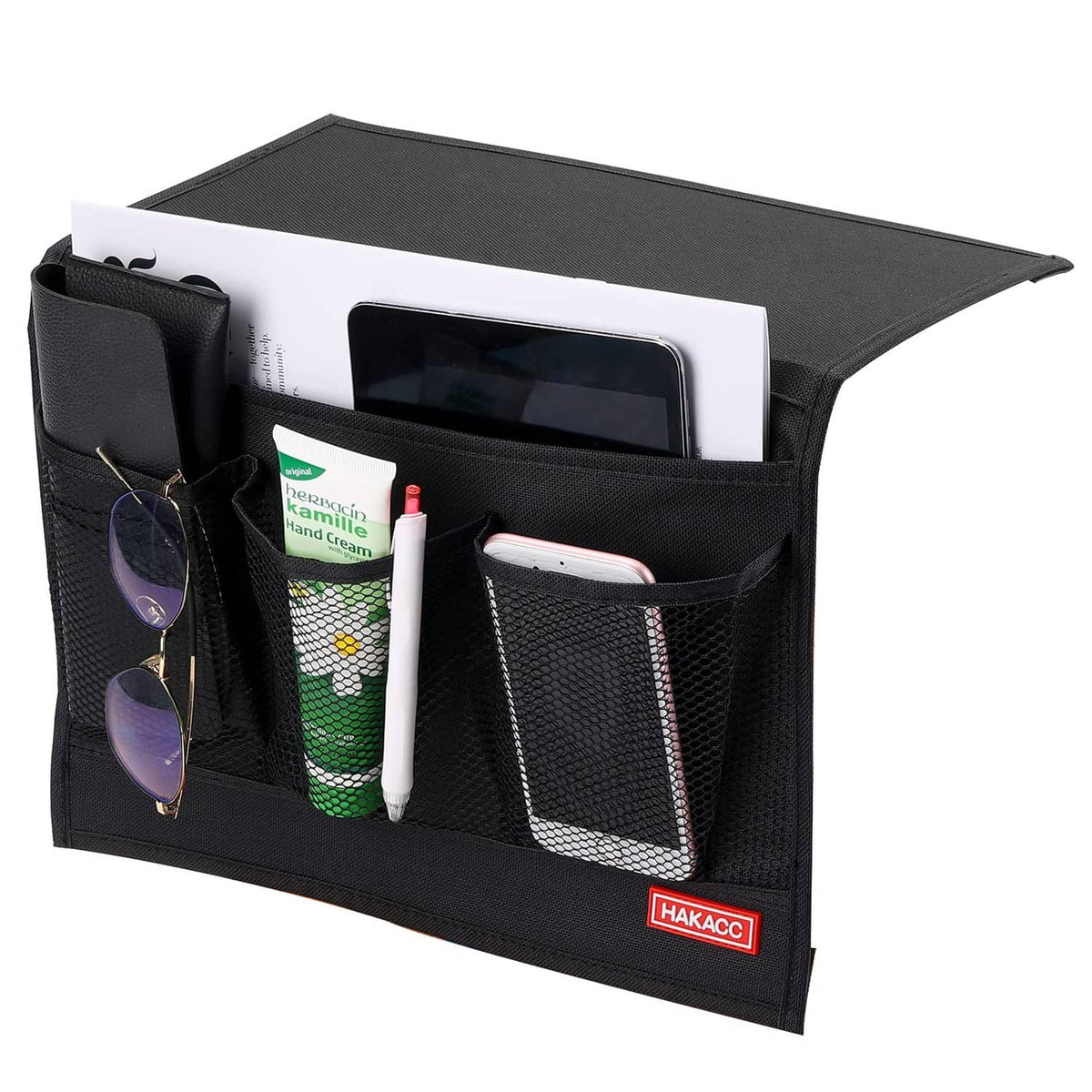 Black bedside storage organizer with front pockets and mesh panels