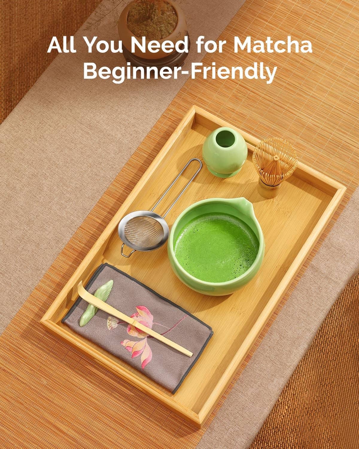 Complete green matcha kit in a wooden tray: bowl, whisk, strainer, scoop and cloth