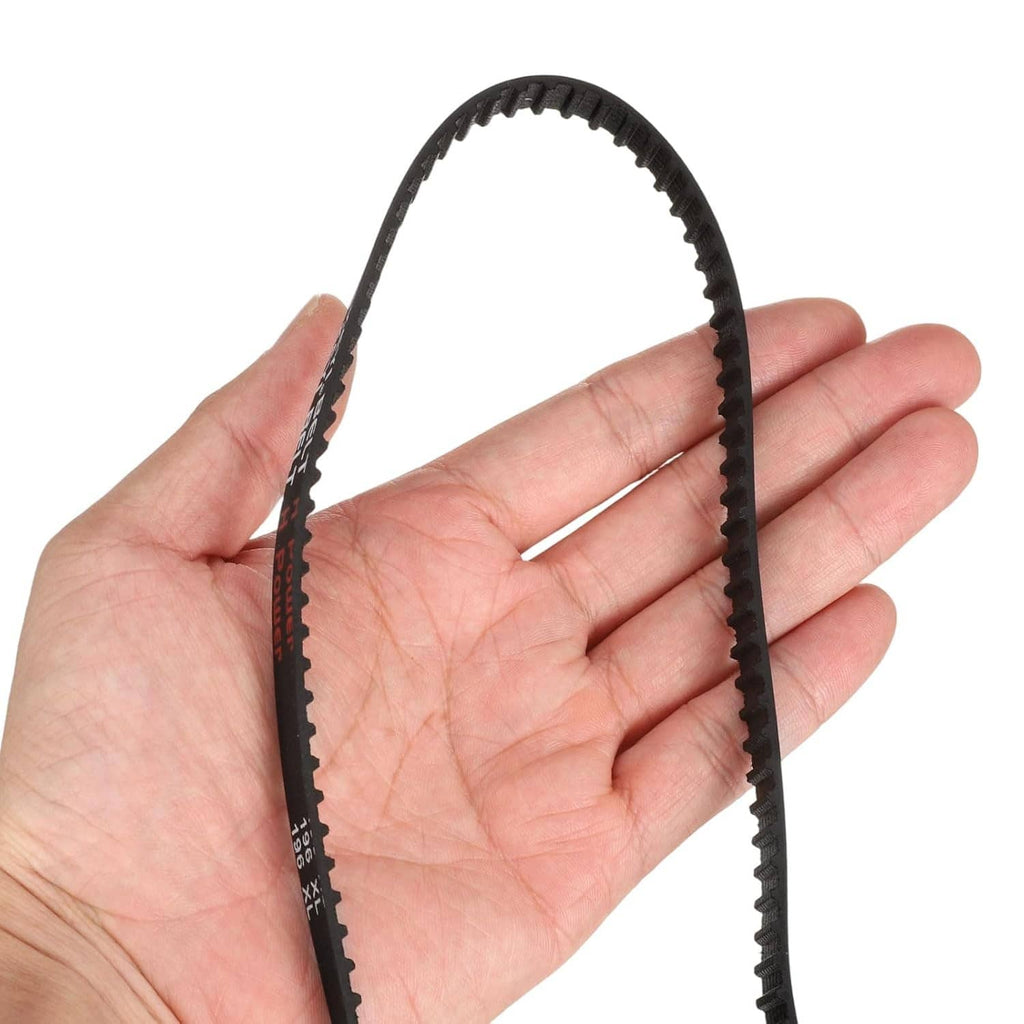 Black rubber timing belt held in a hand, showing flexible toothed edge