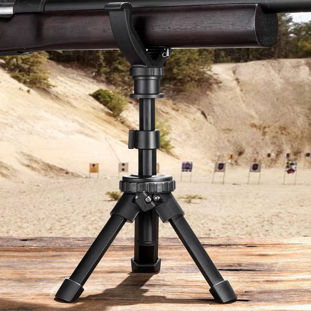 Black shooting tripod with V yoke rest supporting a rifle barrel