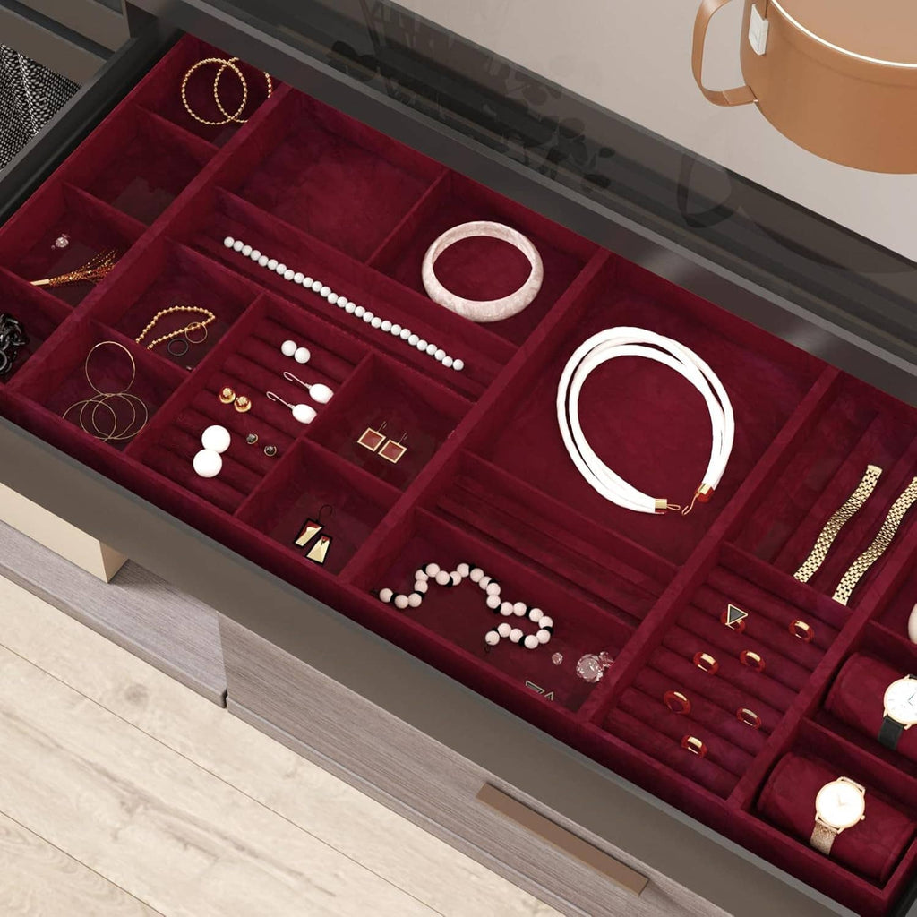 Dark red velvet flock liner sheet lining a jewelry storage drawer tray