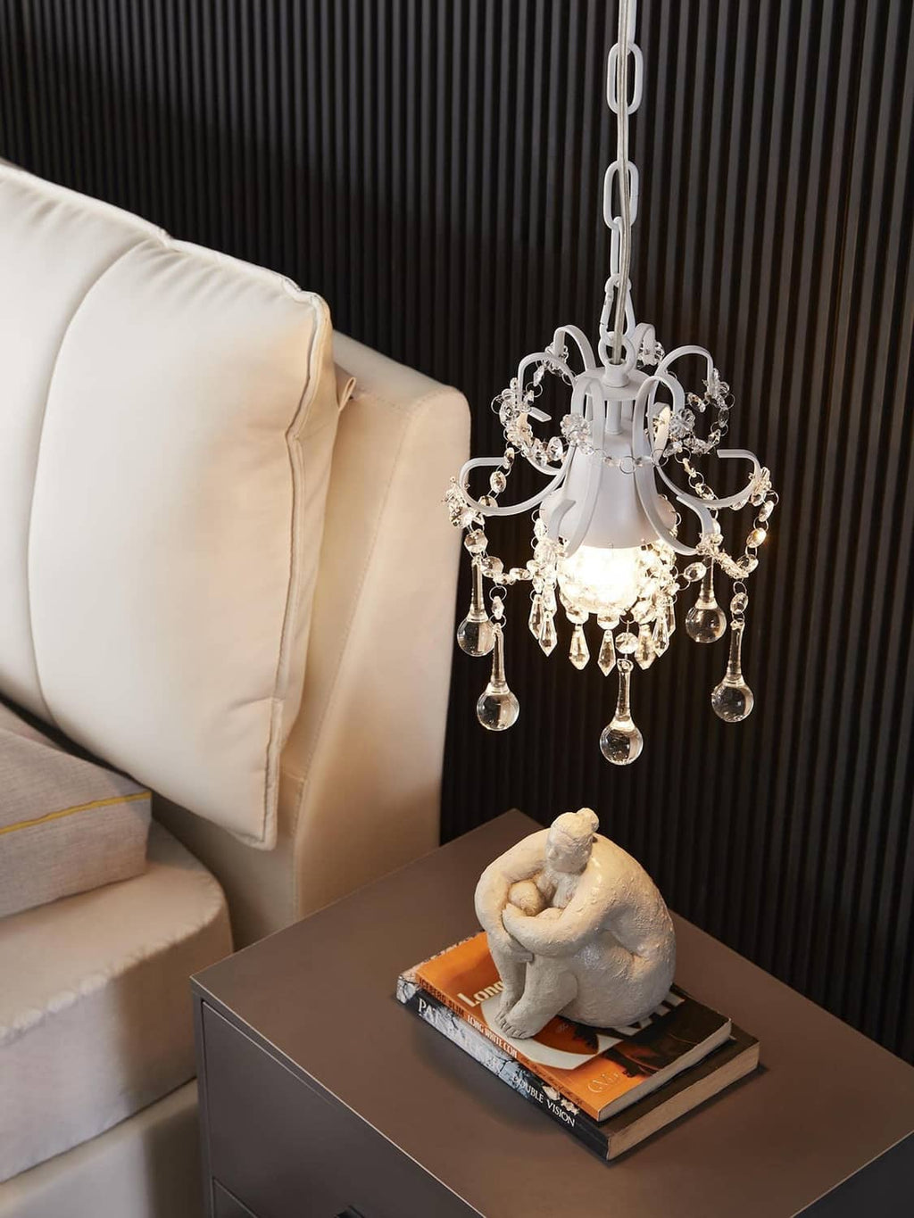 White crystal chandelier pendant light with ornate center and hanging crystal tassels