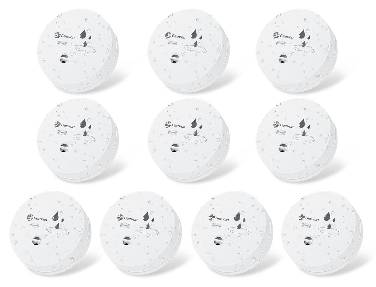 White round water leak detector alarm, showing underside speaker and sensor vent