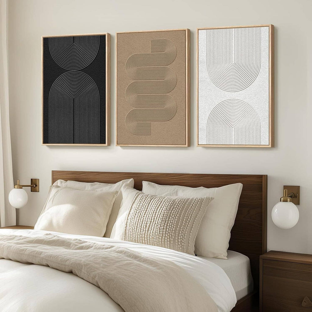 Three framed abstract line art panels with arched lines in black, beige, and light gray