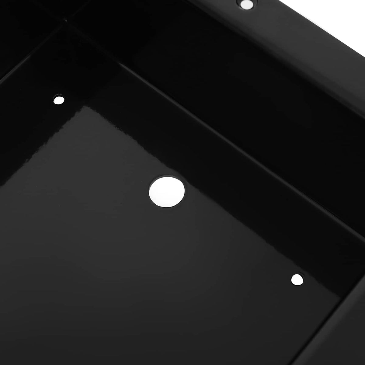 Recessed trolling motor foot pedal pan interior with circular mounting holes on black base.
