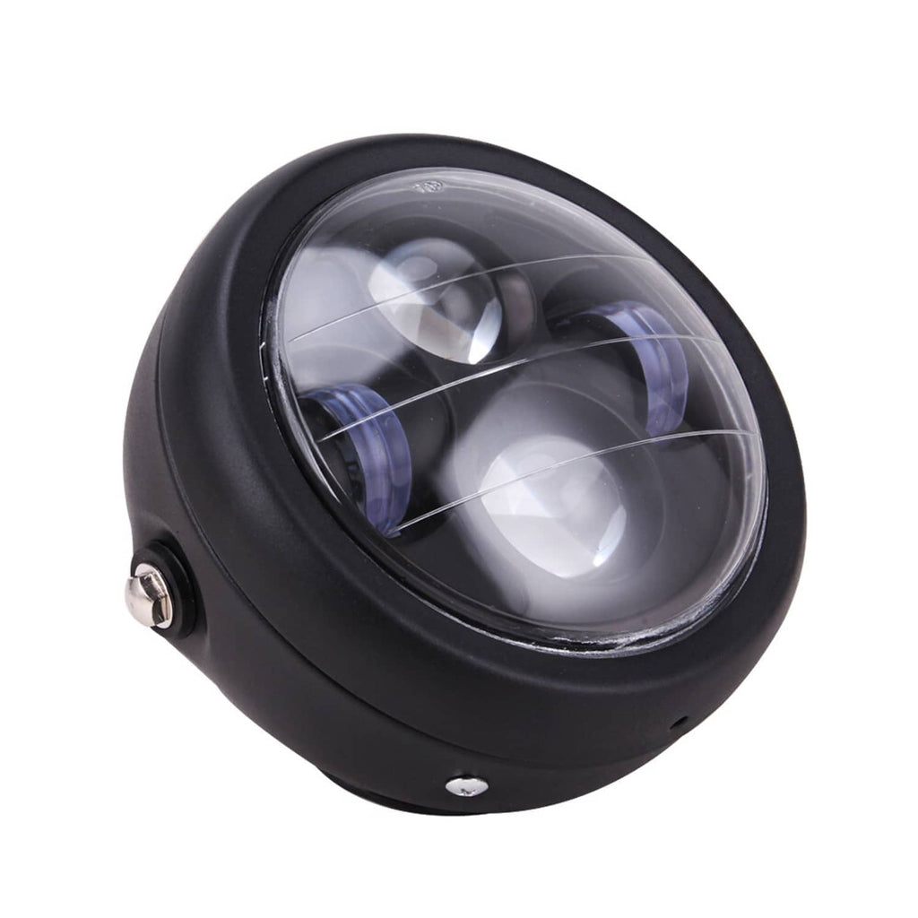 Black 6.5-inch motorcycle headlight with clear oval lens, front 3/4 view