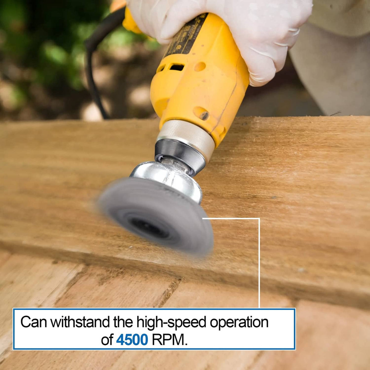 Drill wire brush wheel grinding wood surface, steel bristles on circular metal head